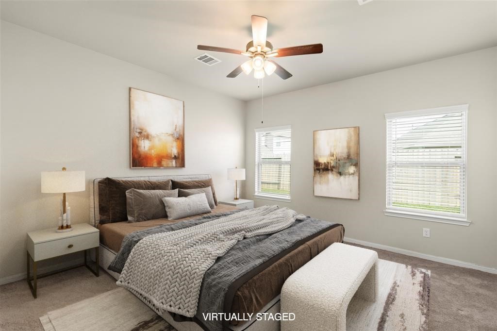 1333 Red Hills Drive Rosharon, TX 77583 - Photo 12 of 29 a bedroom with a bed and a chandelier