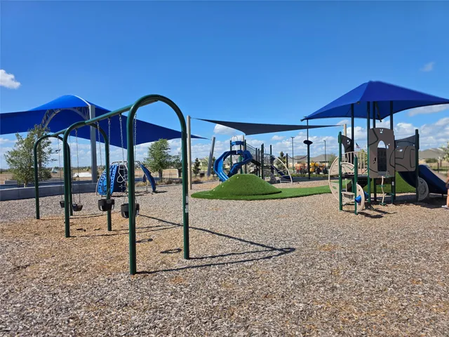a view of a house with backyard and patio