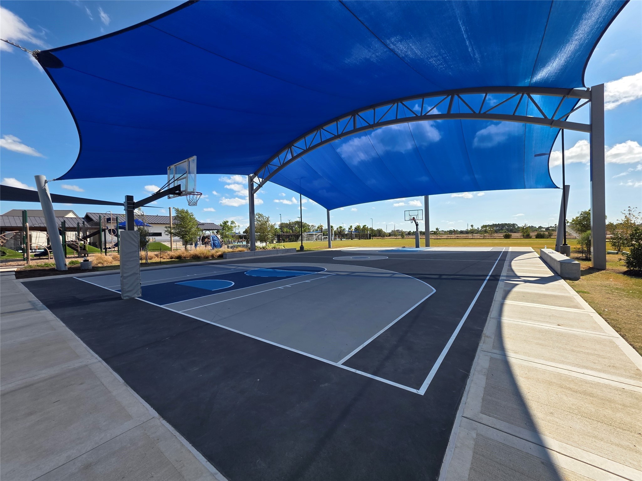 1333 Red Hills Drive Rosharon, TX 77583 - Photo 25 of 29 a view of a patio with a table and chairs under an umbrella
