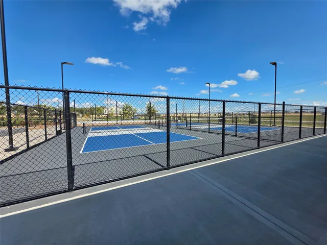 a view of a swimming pool with outdoor seating