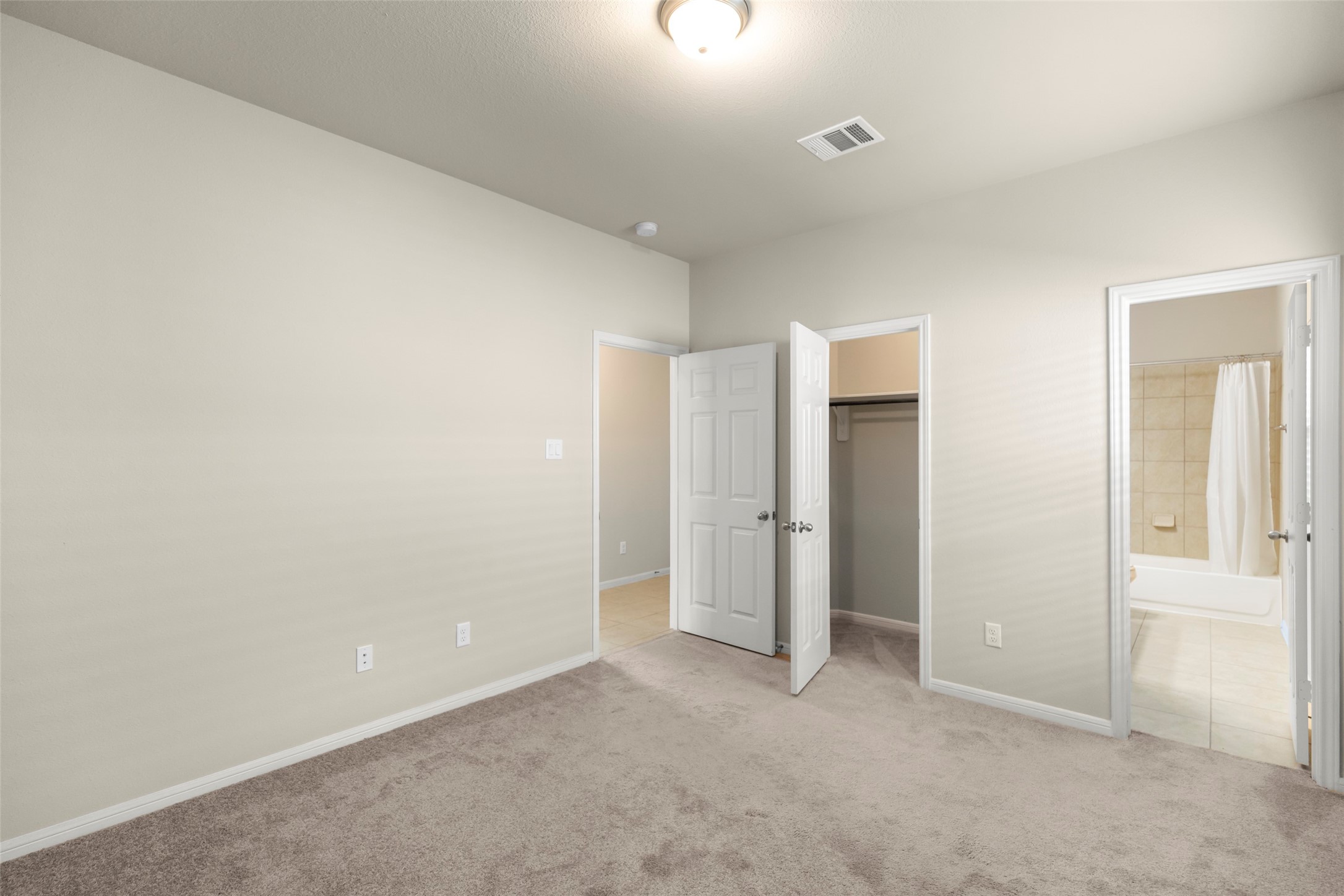 1333 Red Hills Drive Rosharon, TX 77583 - Photo 8 of 29 an empty room with closet and windows