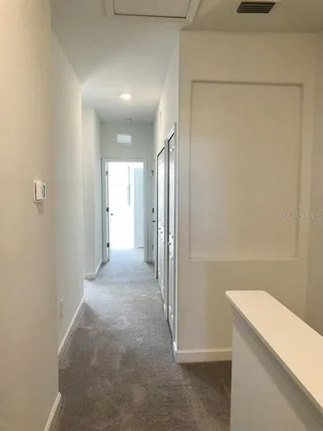 a view of a hallway with storage