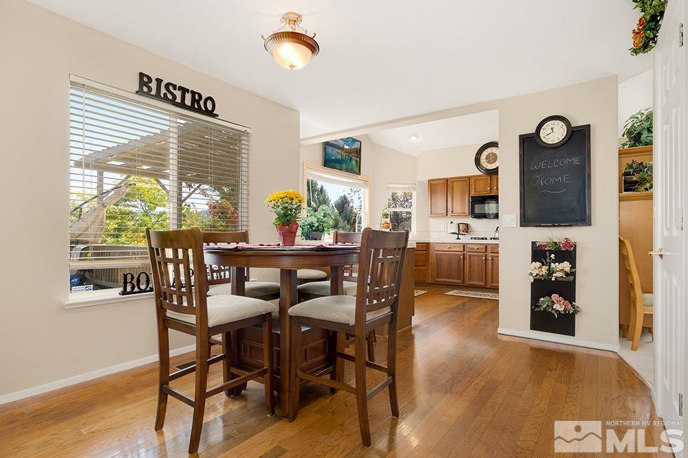 14320 Ghost Rider Drive Reno, NV 89511 - Photo 12 of 40 a dining room with furniture and wooden floor