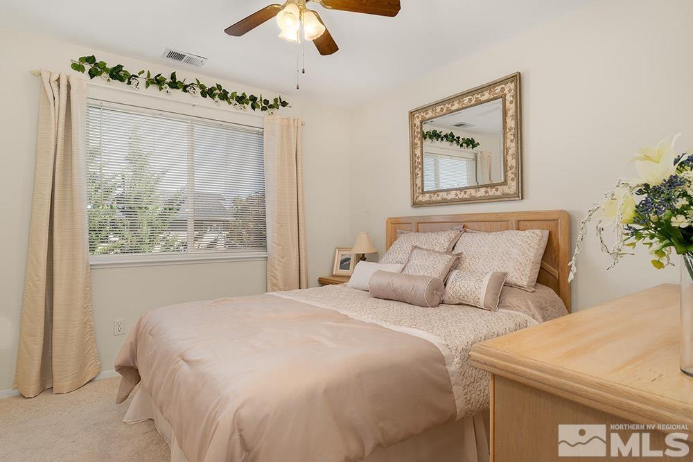 14320 Ghost Rider Drive Reno, NV 89511 - Photo 23 of 40 a bedroom with bed and a window