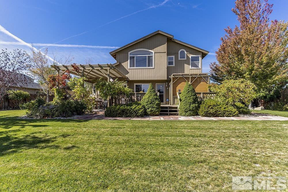 14320 Ghost Rider Drive Reno, NV 89511 - Photo 29 of 40 a front view of a house with a garden