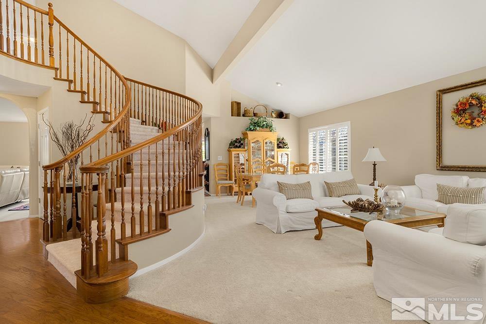 14320 Ghost Rider Drive Reno, NV 89511 - Photo 4 of 40 a living room with fireplace furniture and a table