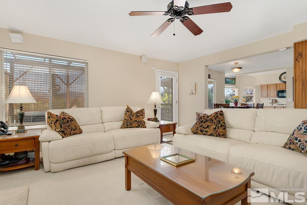 14320 Ghost Rider Drive Reno, NV 89511 - Photo 7 of 40 a living room with furniture and a large window