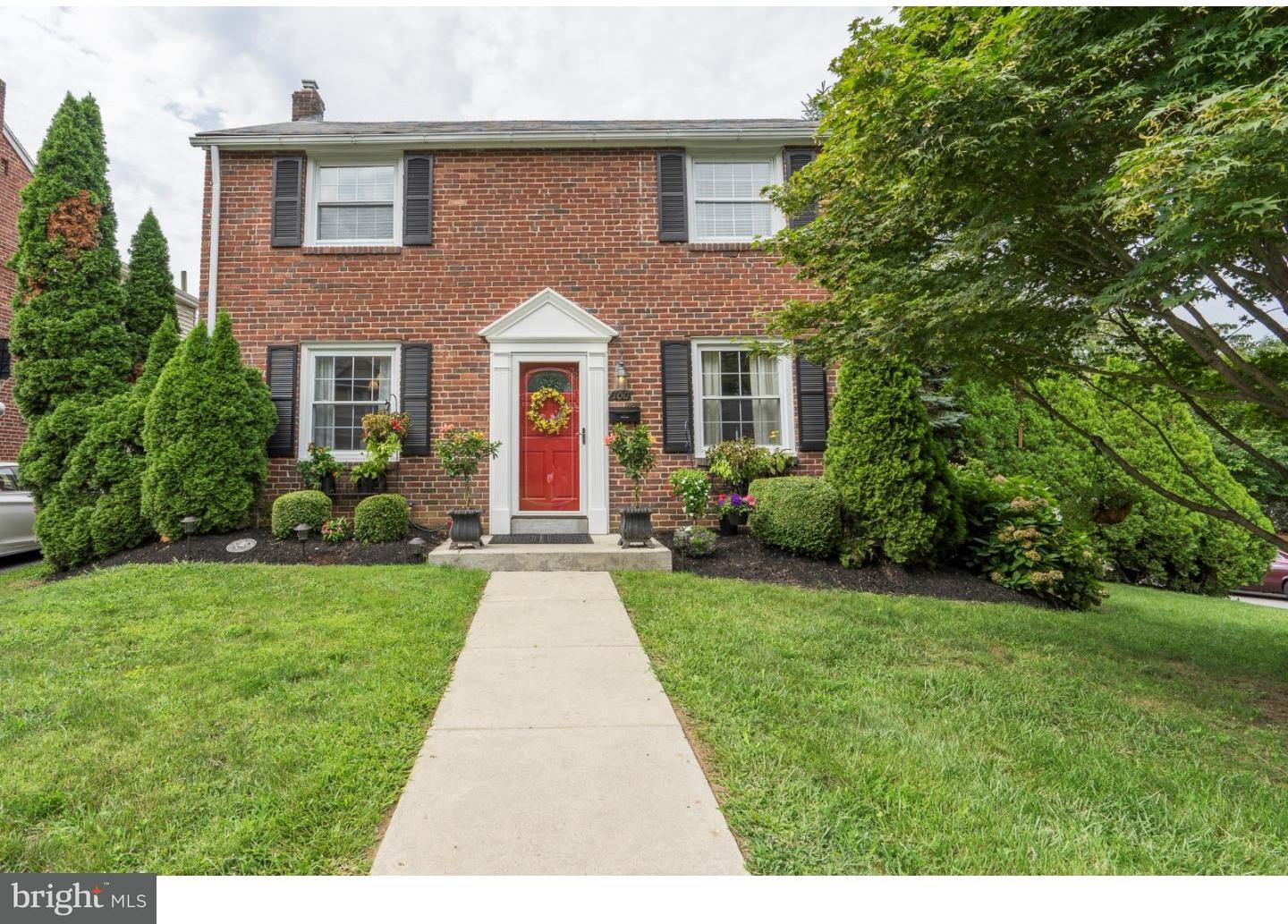 100 Kent Road Springfield, PA 19064 - Photo 1 of 22 a front view of a house with a yard and potted plants