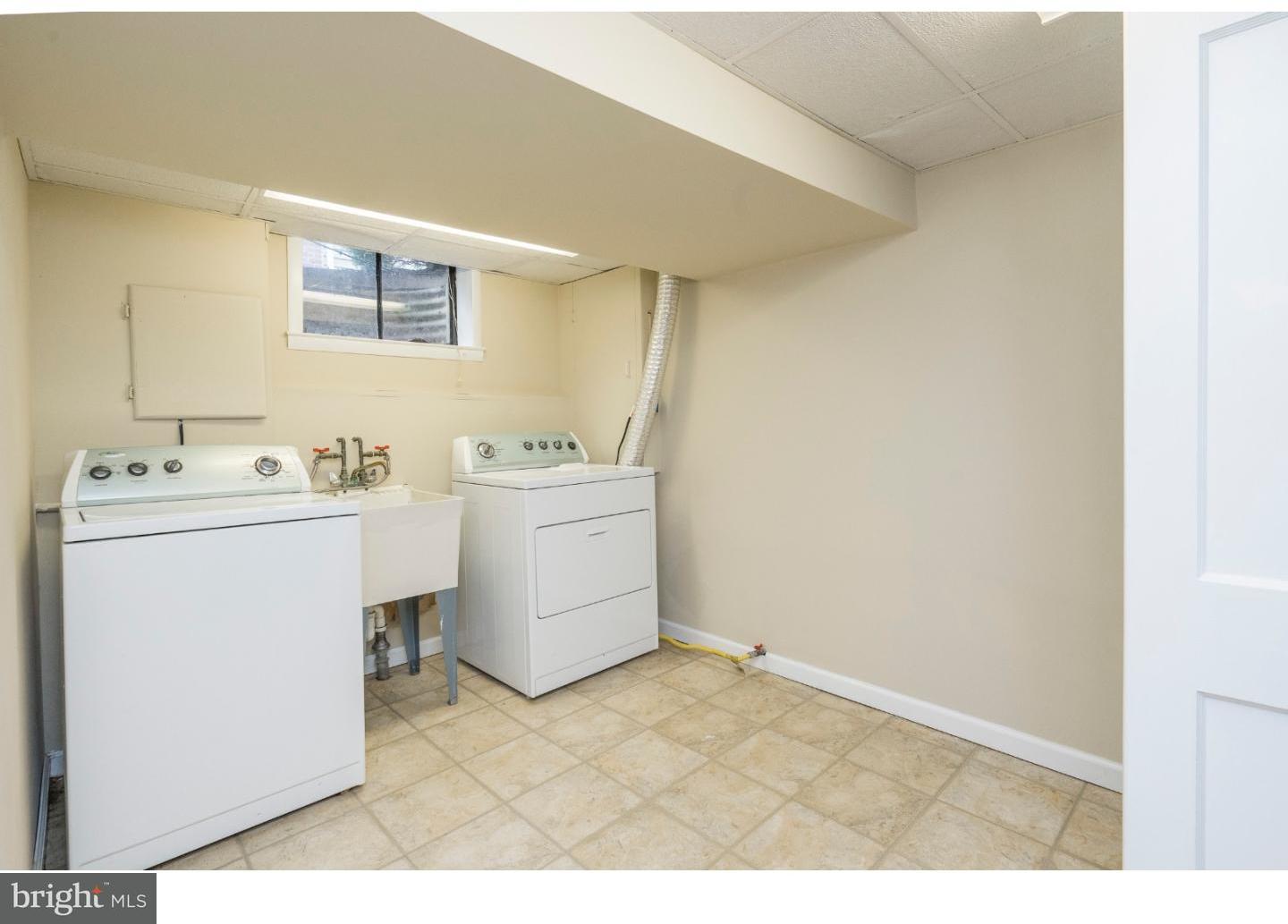 100 Kent Road Springfield, PA 19064 - Photo 21 of 22 a utility room with cabinets washer and dryer