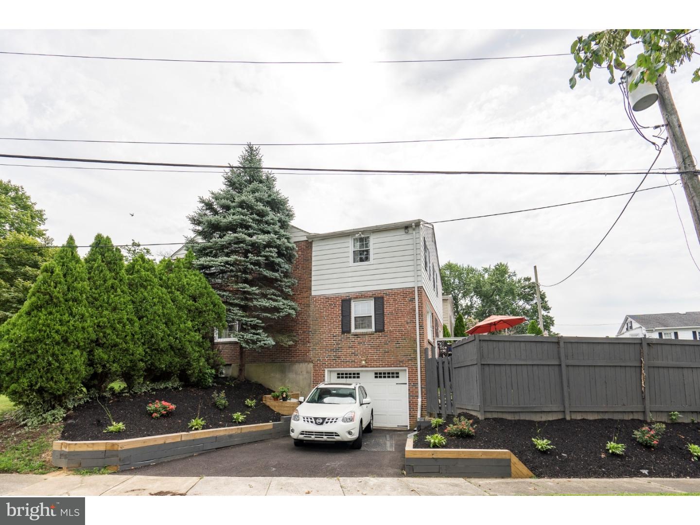 100 Kent Road Springfield, PA 19064 - Photo 22 of 22 a car parked on the side of the road