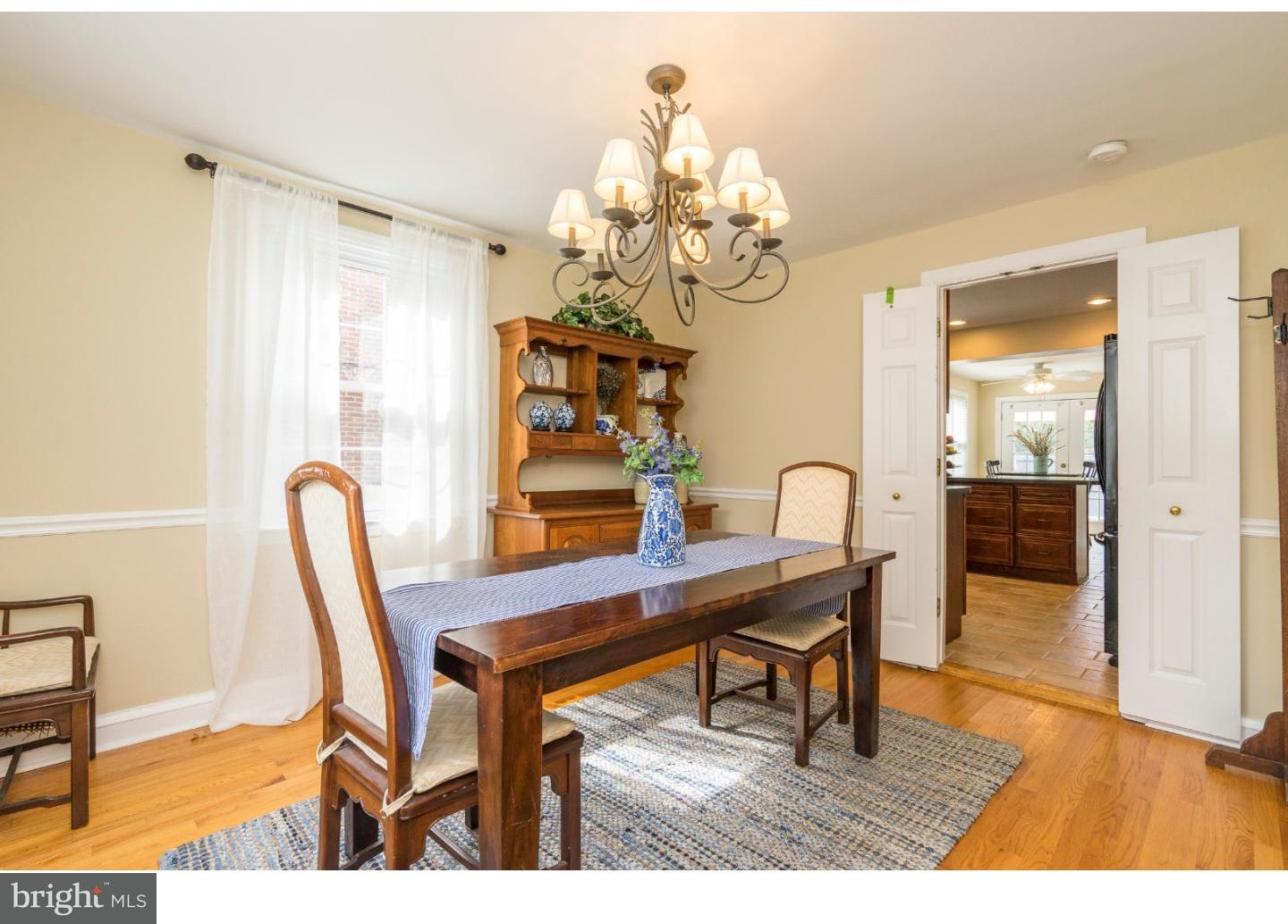 100 Kent Road Springfield, PA 19064 - Photo 5 of 22 a view of a dining room with furniture and chandelier