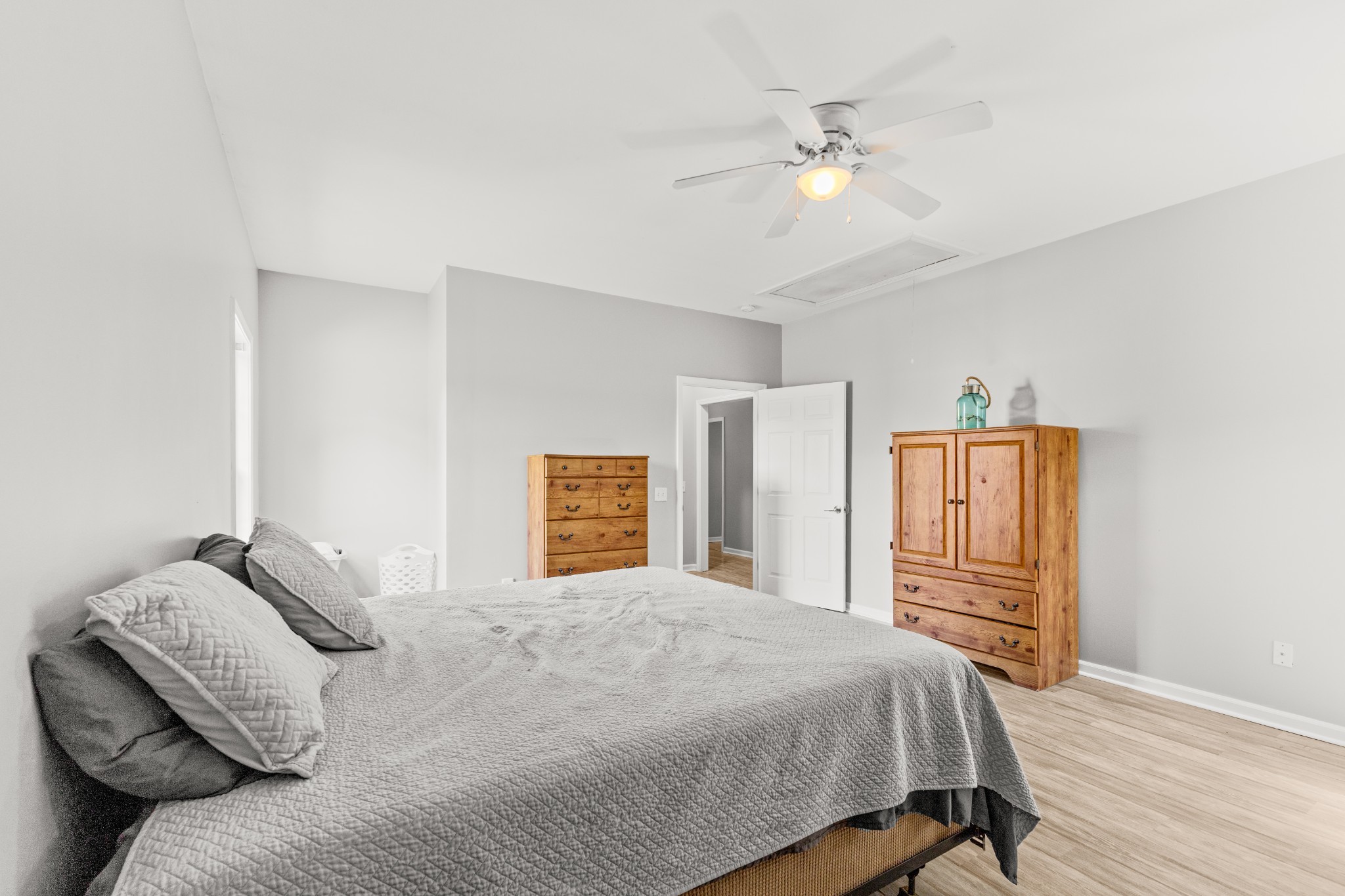 1010 Jacob's Valley Road Joelton, TN 37080 - Photo 26 of 33 a bedroom with a large bed and a chandelier