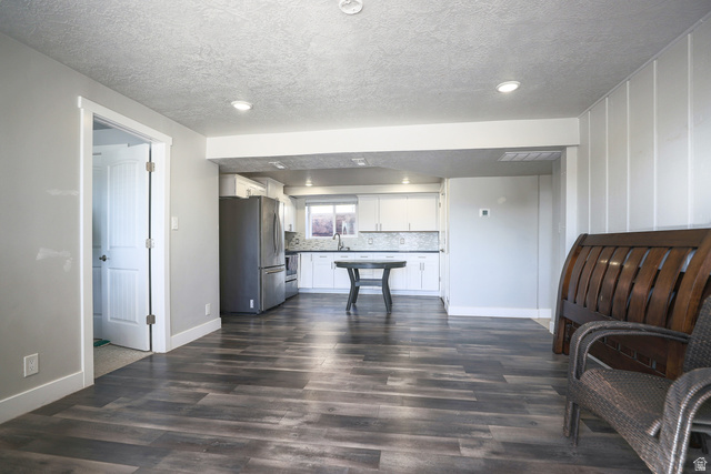 422 West Buckeye Reef Road Leeds, UT 84746 - Photo 24 of 47 Living area down featuring recessed lighting, dark wood finished floors, and a textured ceiling
