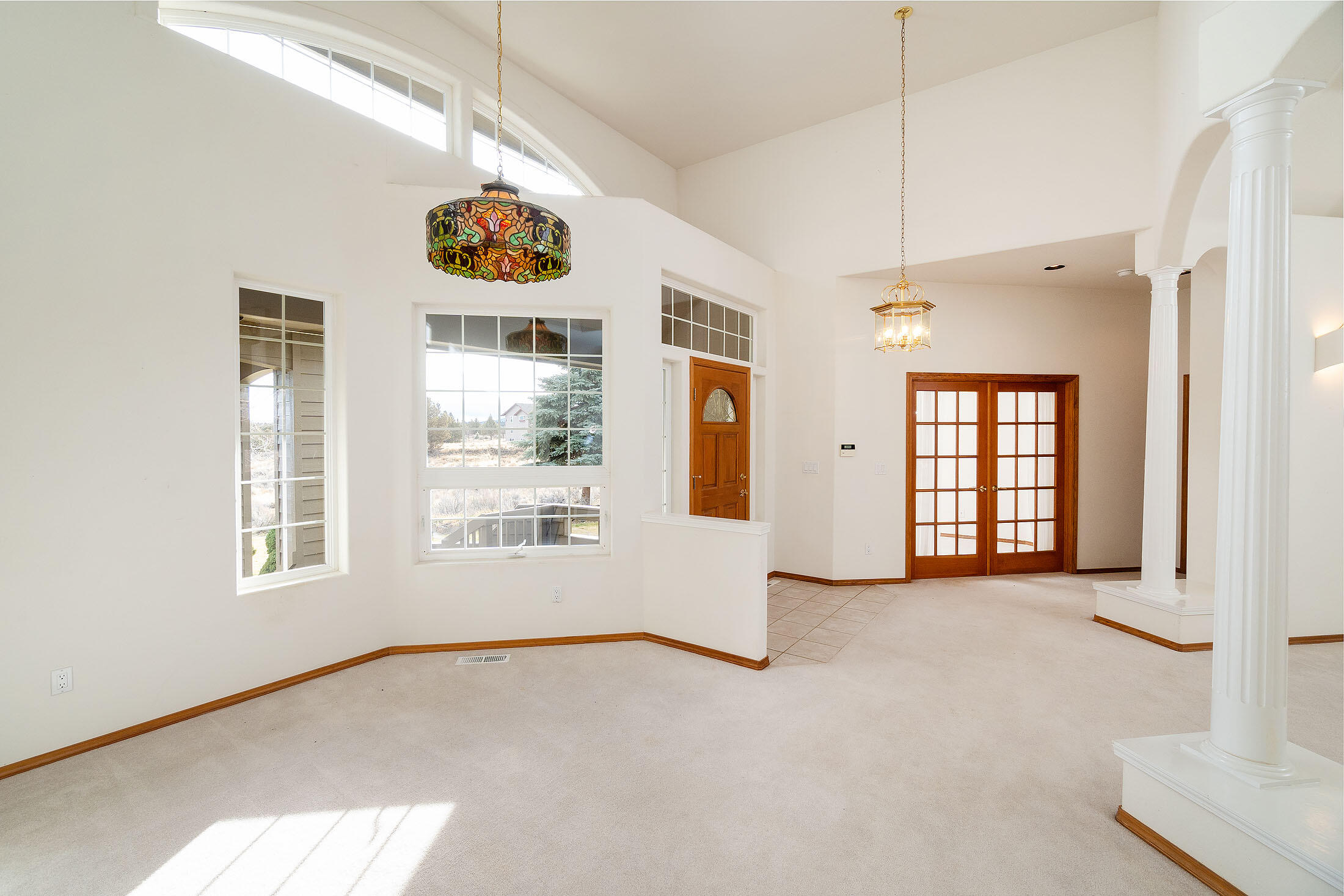 60895 Jennings Road Bend, OR 97702 - Photo 8 of 47 a view of an empty room with a window