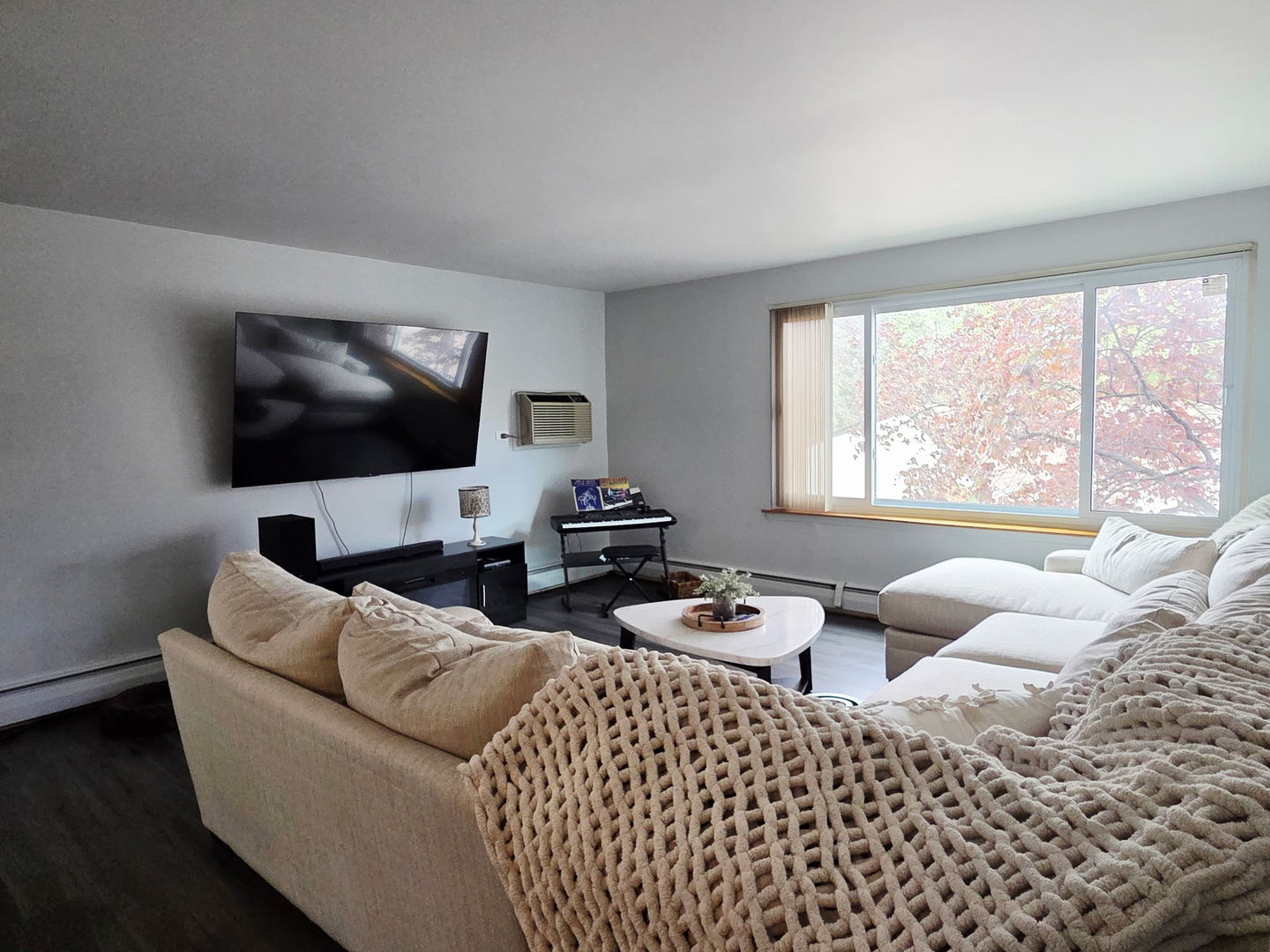 1217 South Old Wilke Road, Unit 201 Rolling Meadows, IL 60005 - Photo 6 of 26 a living room with furniture window and a flat screen tv