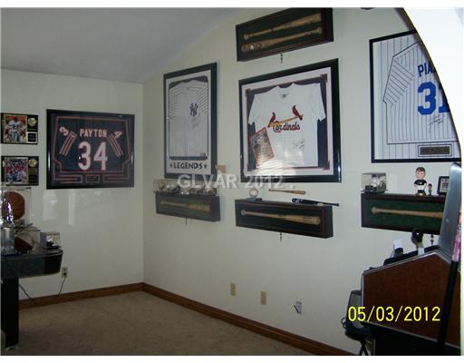 8820 Rancho Destino Road Las Vegas, NV 89123 - Photo 11 of 13 Den. LARGE FAMILY OR GAME ROOM WITH LARGE ARCH ENTRY, VAULTED CEILING AND CIEILING FAN