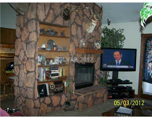 8820 Rancho Destino Road Las Vegas, NV 89123 - Photo 8 of 13 Other. WONDERFUL ROCK CEILING TO FLOOR WITH HEARTH AND BUILT IN BOOK SHELVES, TWO WAY FACING DINING ROOM AND LIVING ROOM