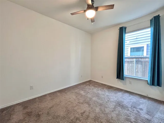 an empty room with windows and entrance