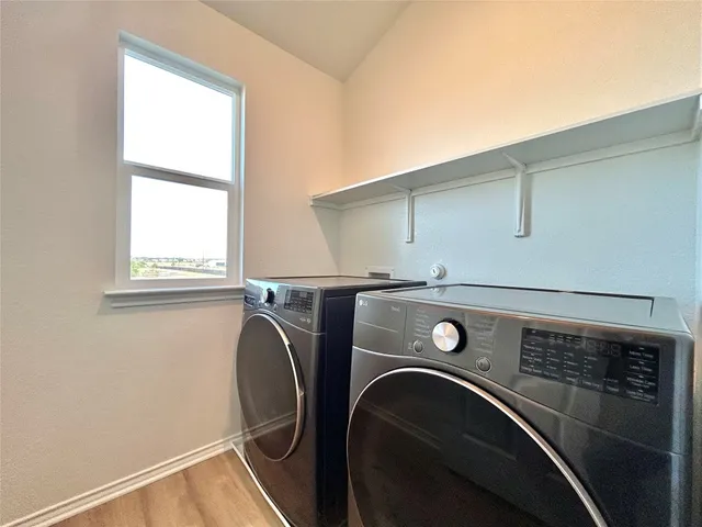 a utility room with dryer and washer