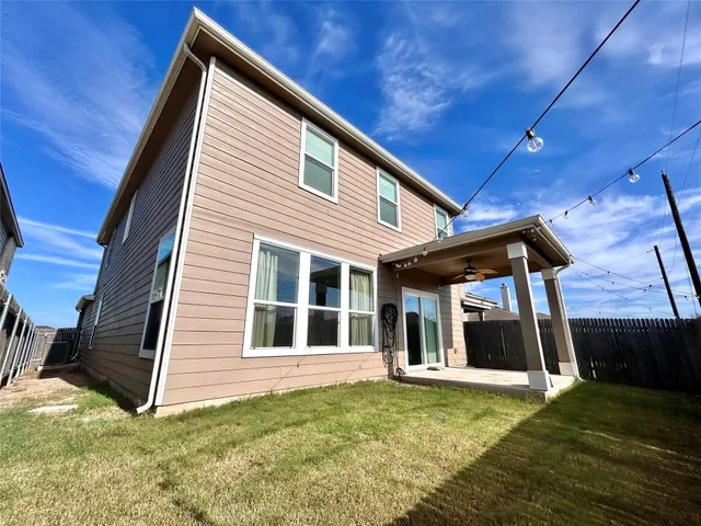 a house view with a backyard space