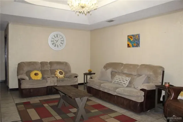 a living room with furniture and a table