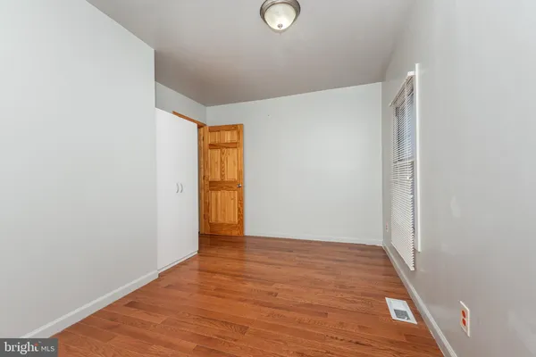a view of balcony with wooden floor