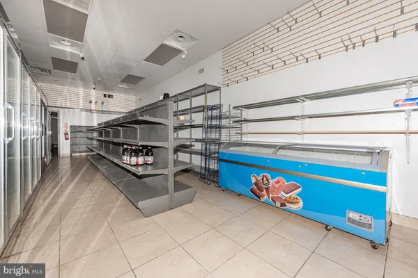 a bathroom with a sink mirror and toilet