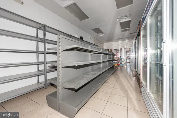a kitchen with stainless steel appliances a refrigerator and a sink
