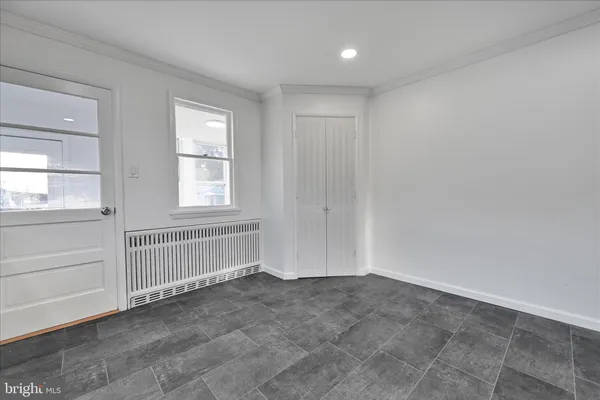 a kitchen with stainless steel appliances granite countertop a refrigerator a stove and a sink