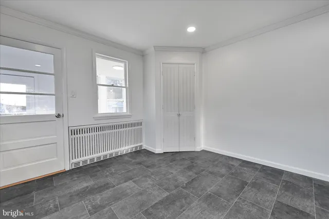 a kitchen with stainless steel appliances granite countertop a refrigerator a stove and a sink