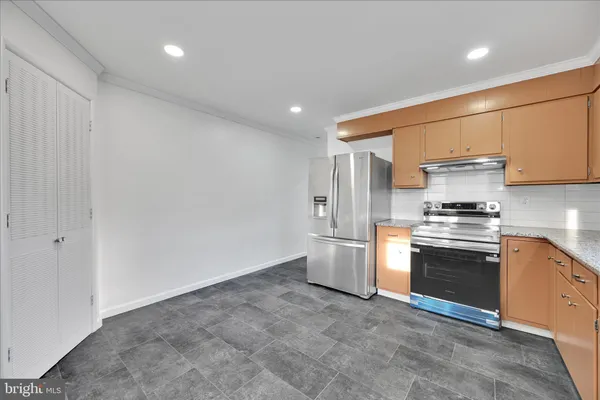 a bathroom with a toilet a sink and a mirror