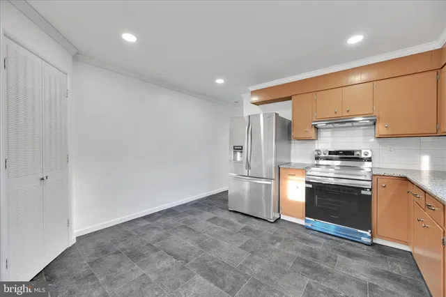 a bathroom with a toilet a sink and a mirror