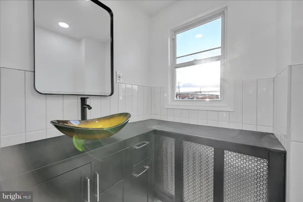 a bathroom with a shower a toilet and sink