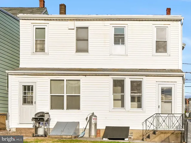 a front view of a house with many windows
