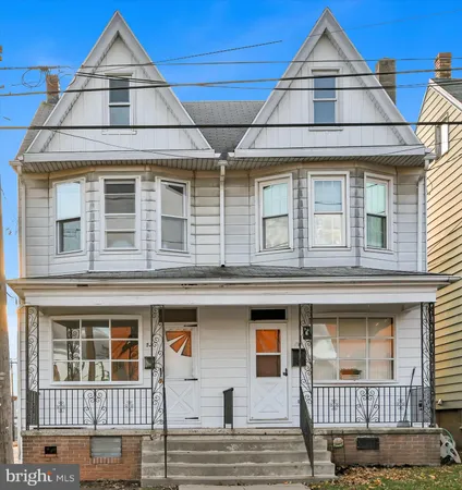 a balcony view with lot of frames on wall