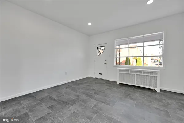 an empty room with a natural light
