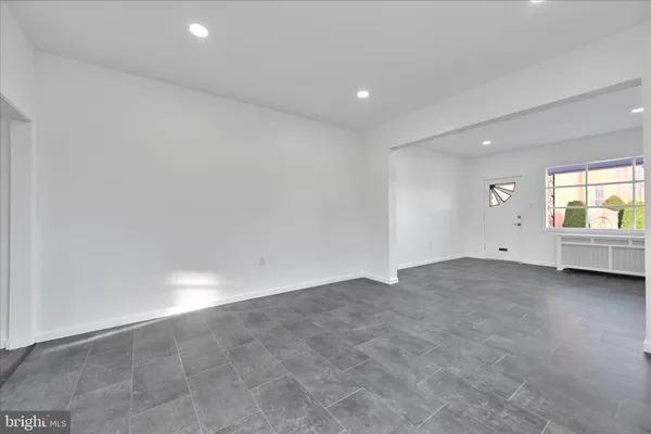 a kitchen with stainless steel appliances granite countertop a refrigerator sink and stove