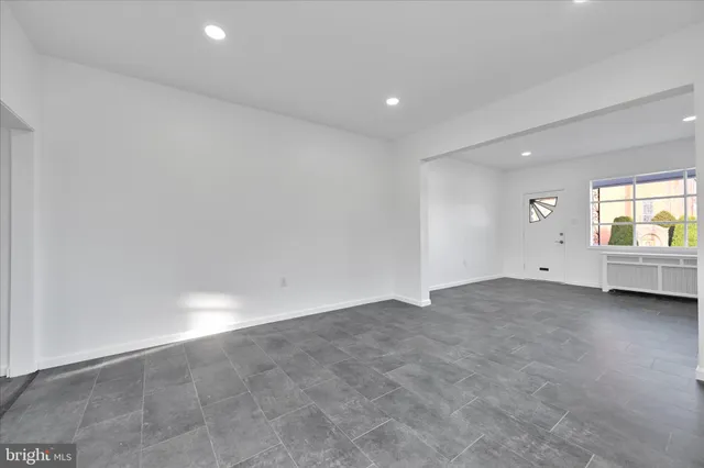 a kitchen with stainless steel appliances granite countertop a refrigerator sink and stove