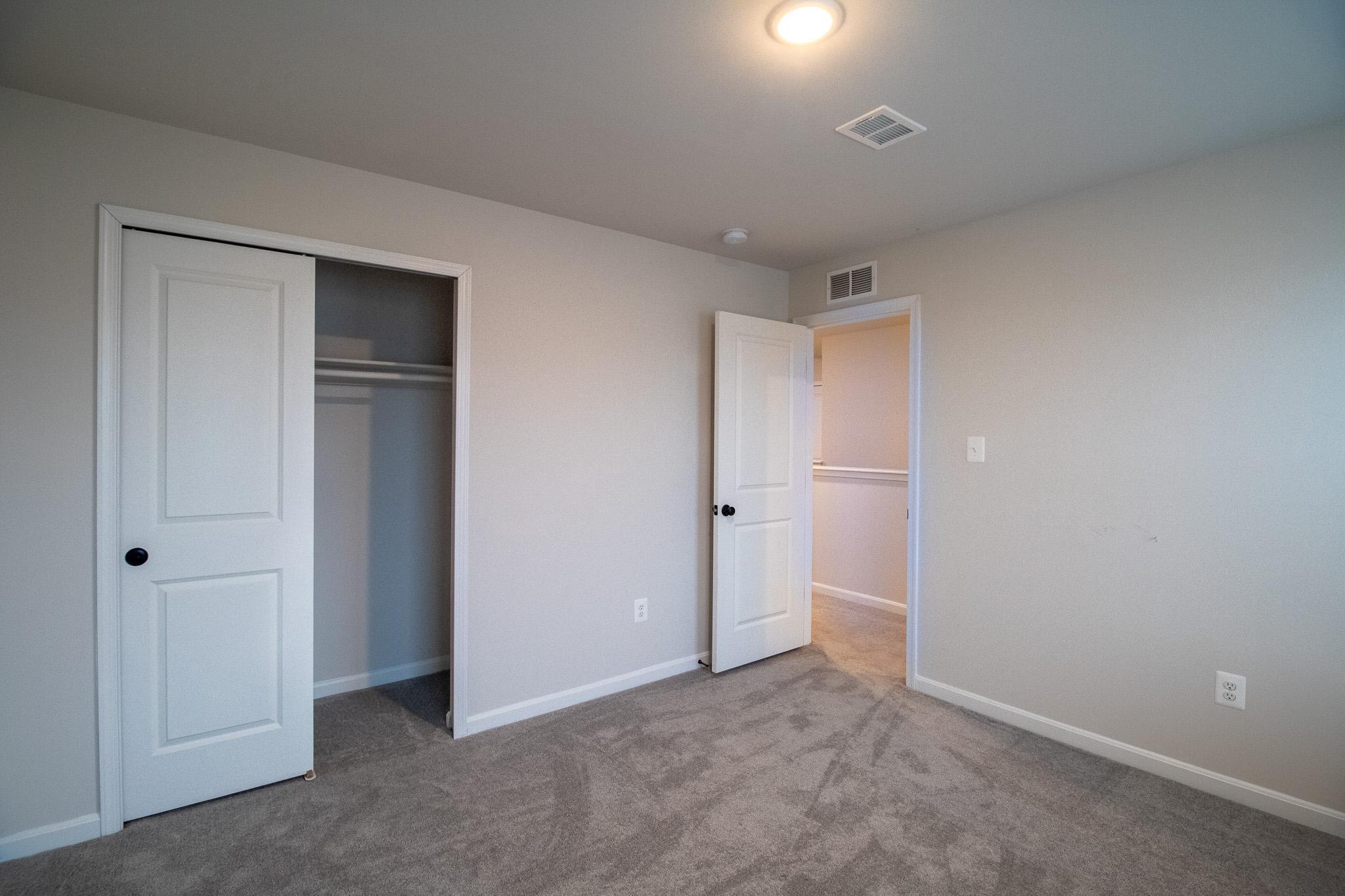 154 Diving Scaup Road Hedgesville, WV 25427 - Photo 50 of 63 Bright and inviting bedroom with ample space.