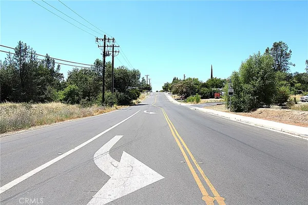 a view of a street with a building in the background