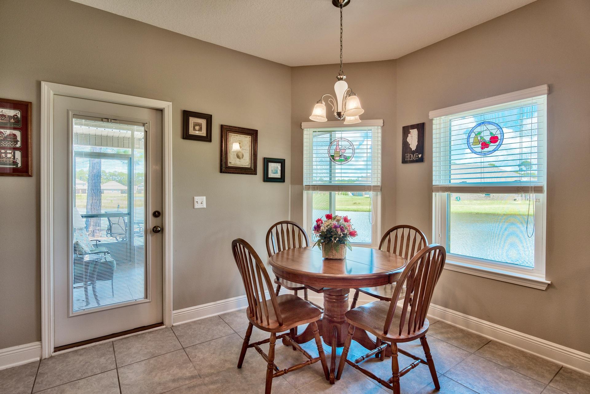 465 Pin Oak Loop Santa Rosa Beach, FL 32459 - Photo 11 of 38 a view of a dining room with furniture window and wooden floor