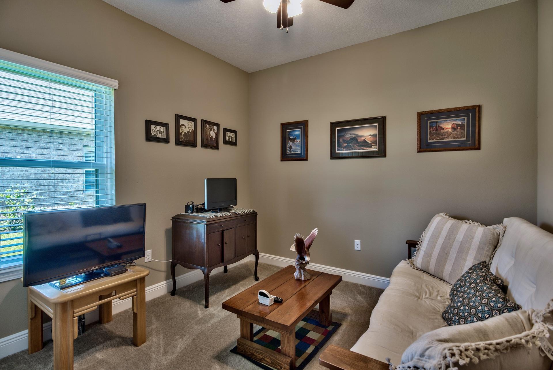 465 Pin Oak Loop Santa Rosa Beach, FL 32459 - Photo 16 of 38 a living room with furniture a rug and a window