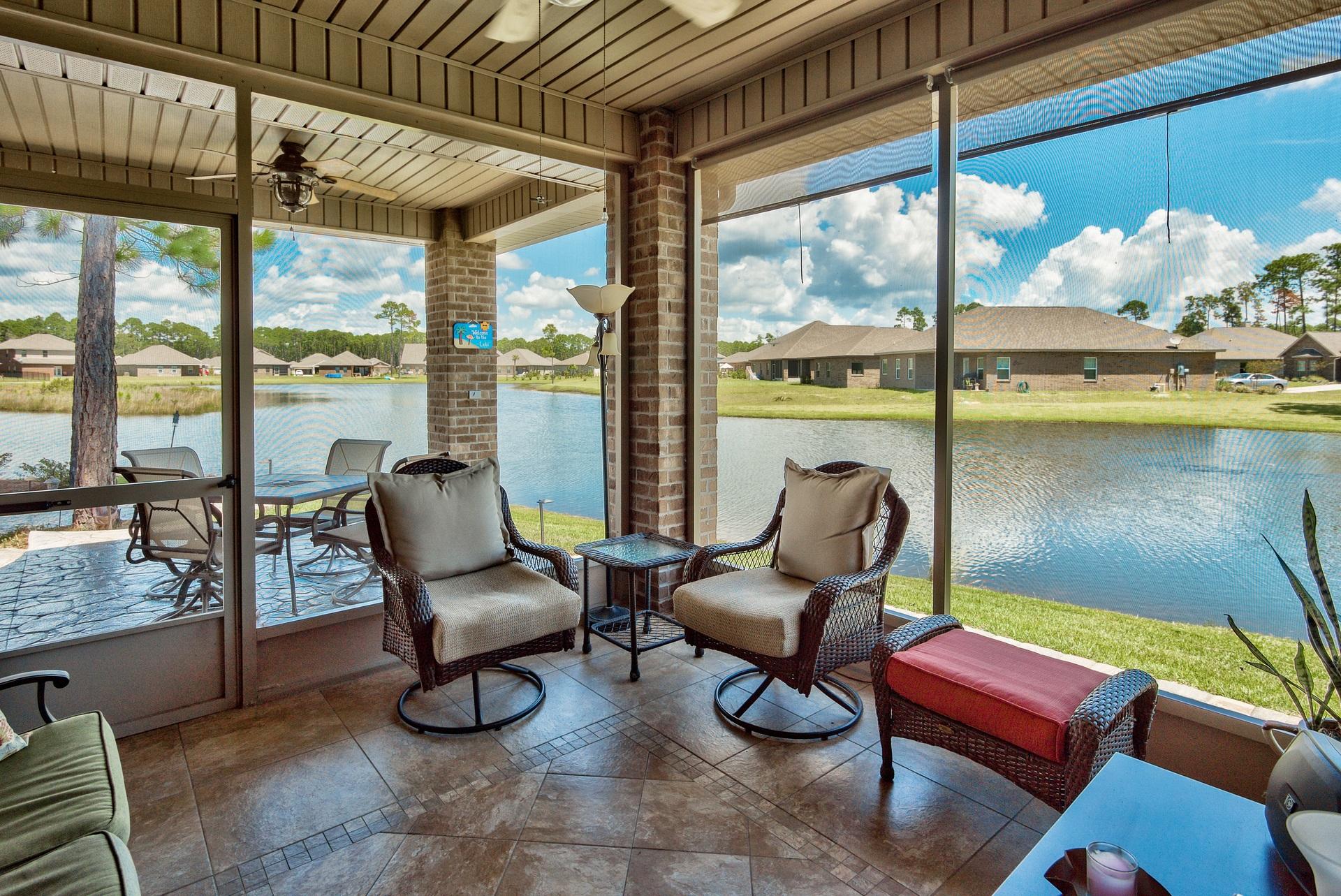 465 Pin Oak Loop Santa Rosa Beach, FL 32459 - Photo 19 of 38 a living room with furniture and a floor to ceiling window