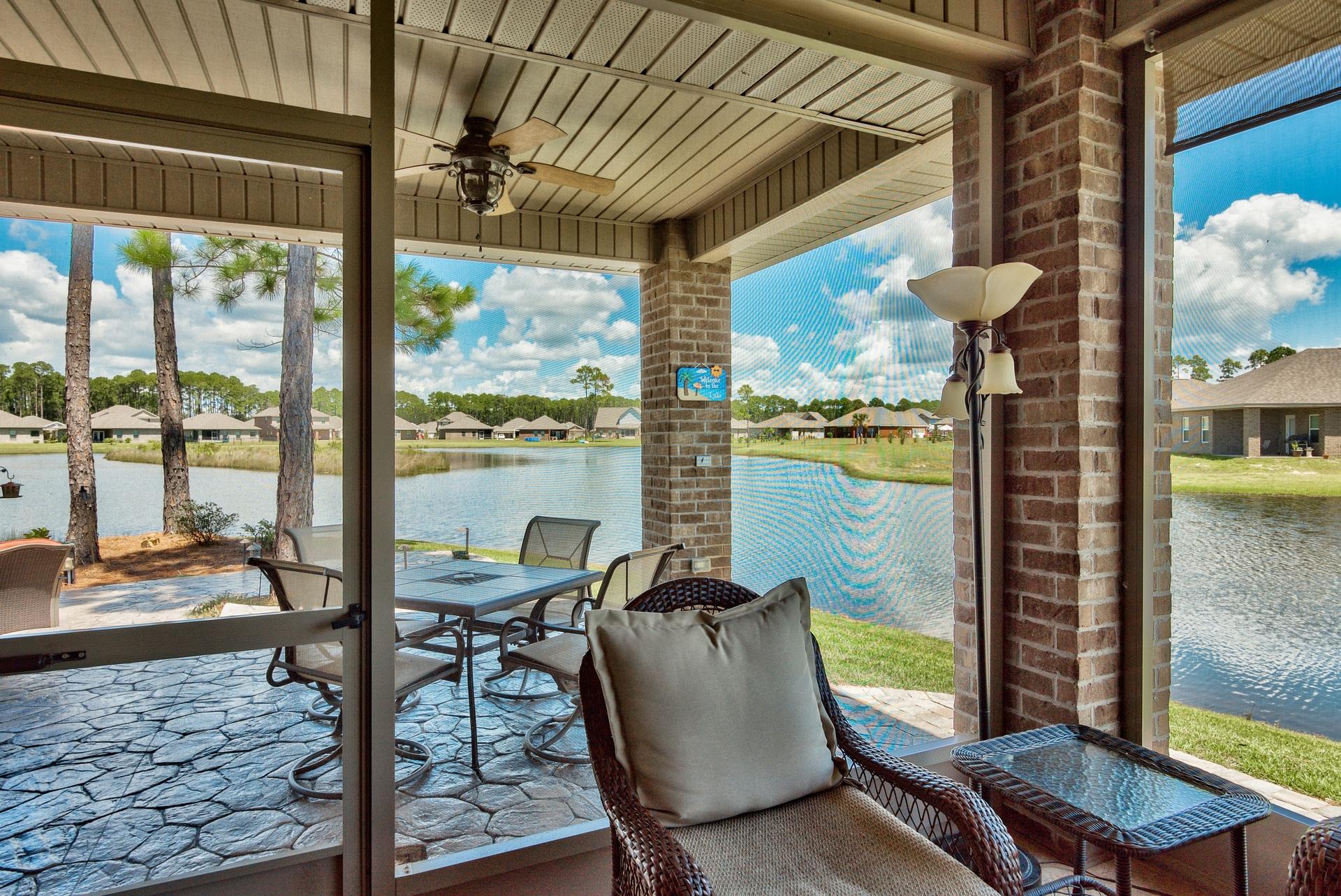 465 Pin Oak Loop Santa Rosa Beach, FL 32459 - Photo 20 of 38 a view of a balcony with chair and wooden floor