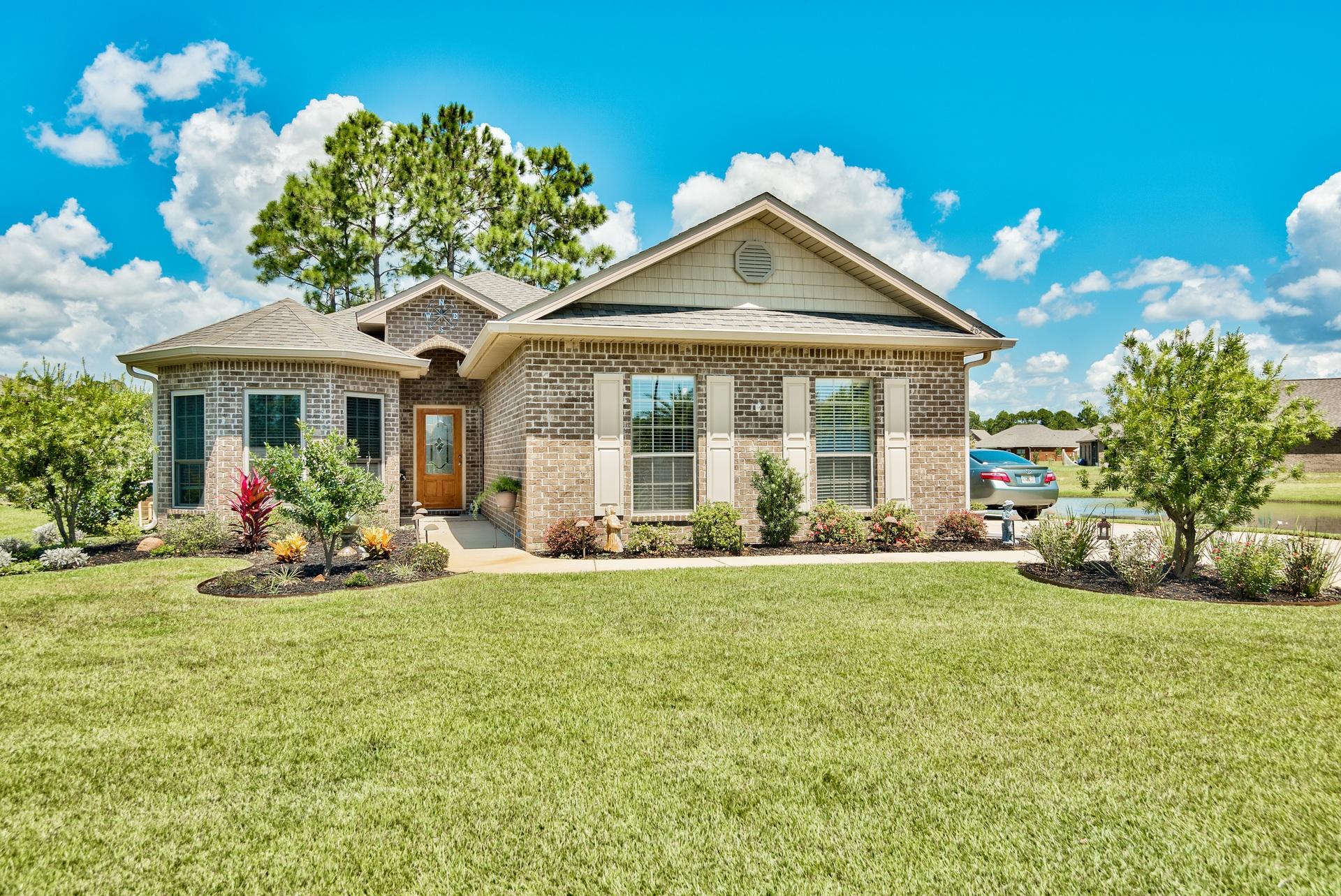 465 Pin Oak Loop Santa Rosa Beach, FL 32459 - Photo 2 of 38 a front view of a house with a yard