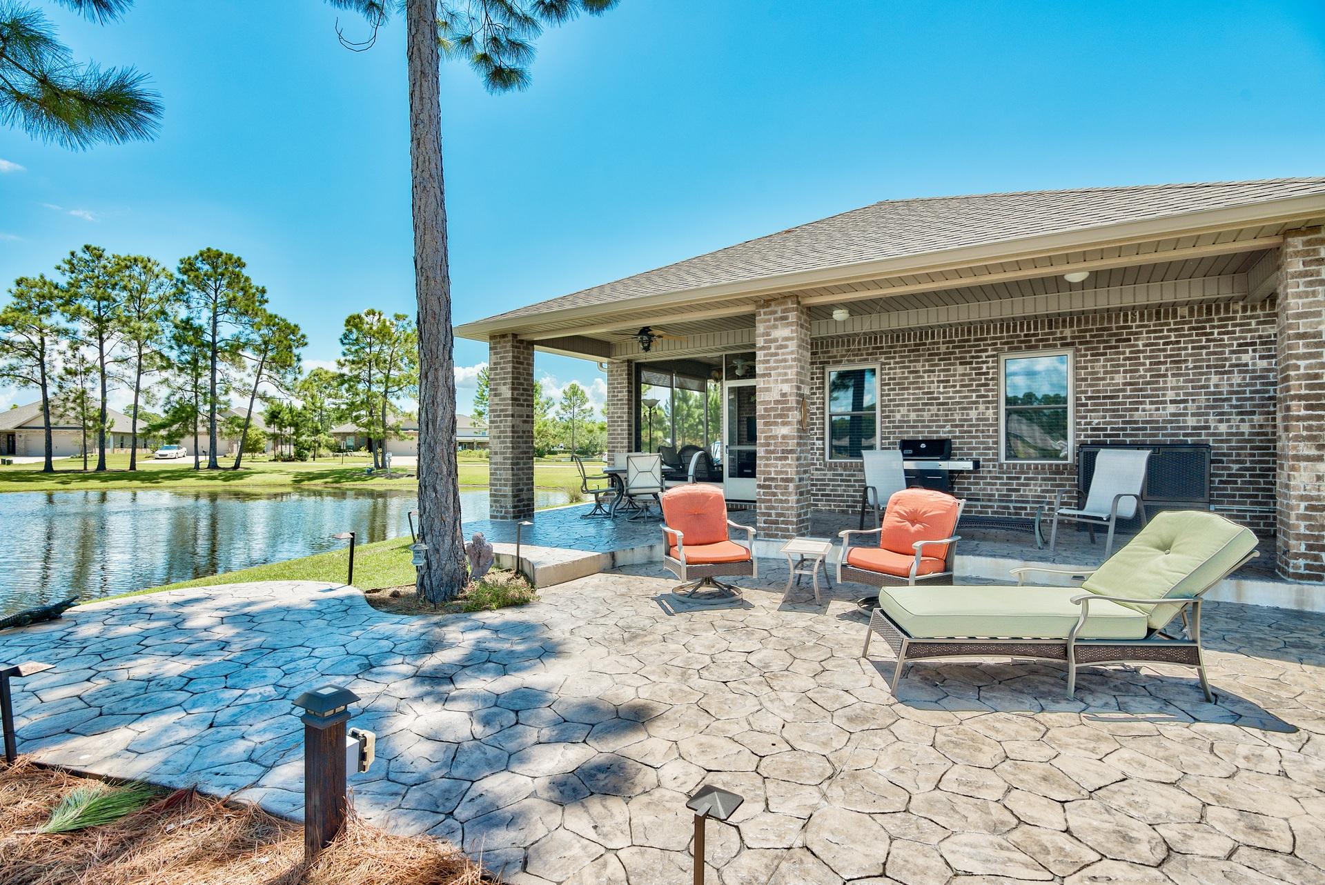 465 Pin Oak Loop Santa Rosa Beach, FL 32459 - Photo 22 of 38 a outdoor space with patio the couches and pool table with chairs