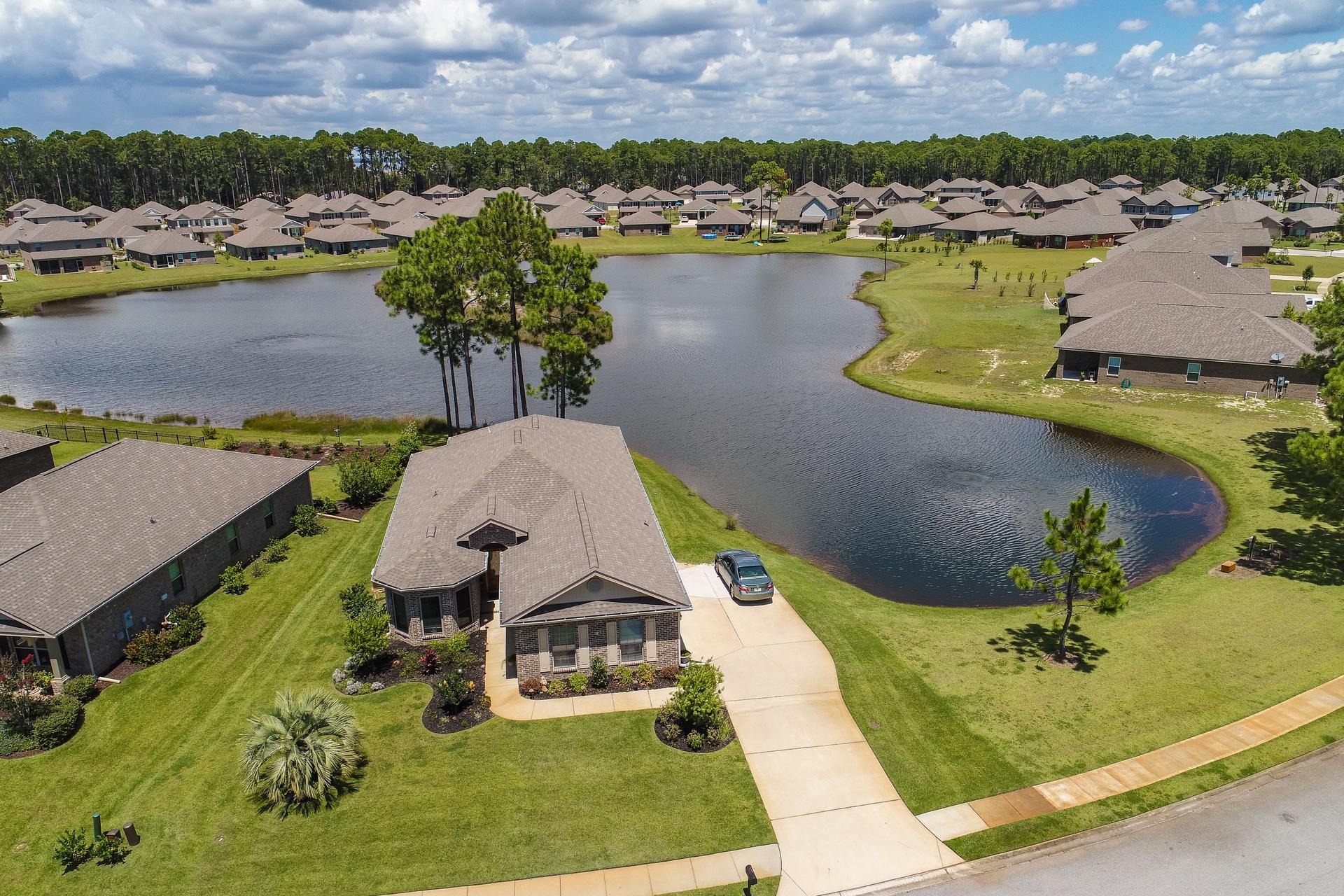 465 Pin Oak Loop Santa Rosa Beach, FL 32459 - Photo 26 of 38 an aerial view of a house with a lake view