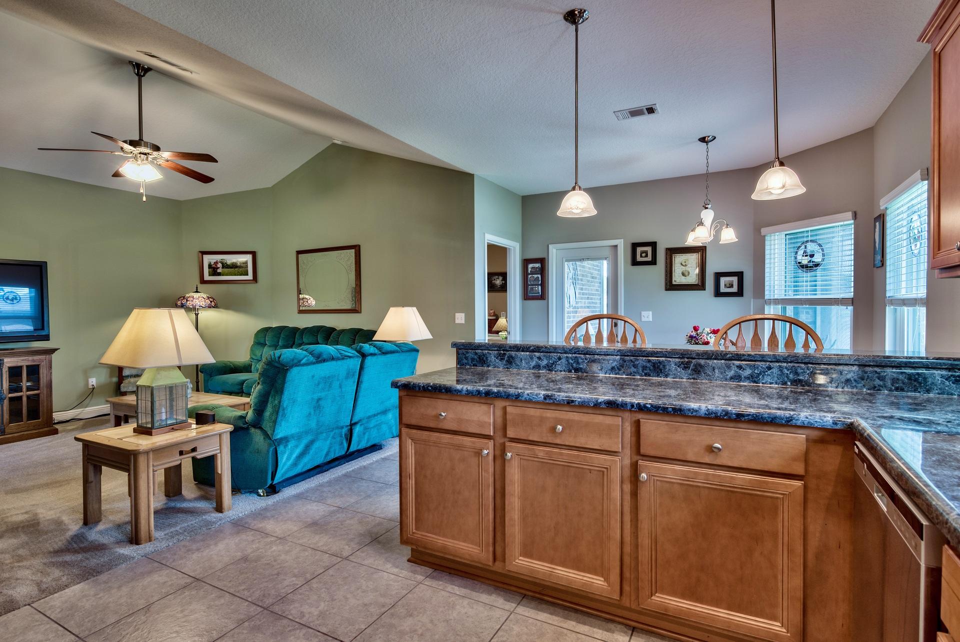465 Pin Oak Loop Santa Rosa Beach, FL 32459 - Photo 10 of 38 a kitchen with granite countertop a stove a sink and a wooden floors