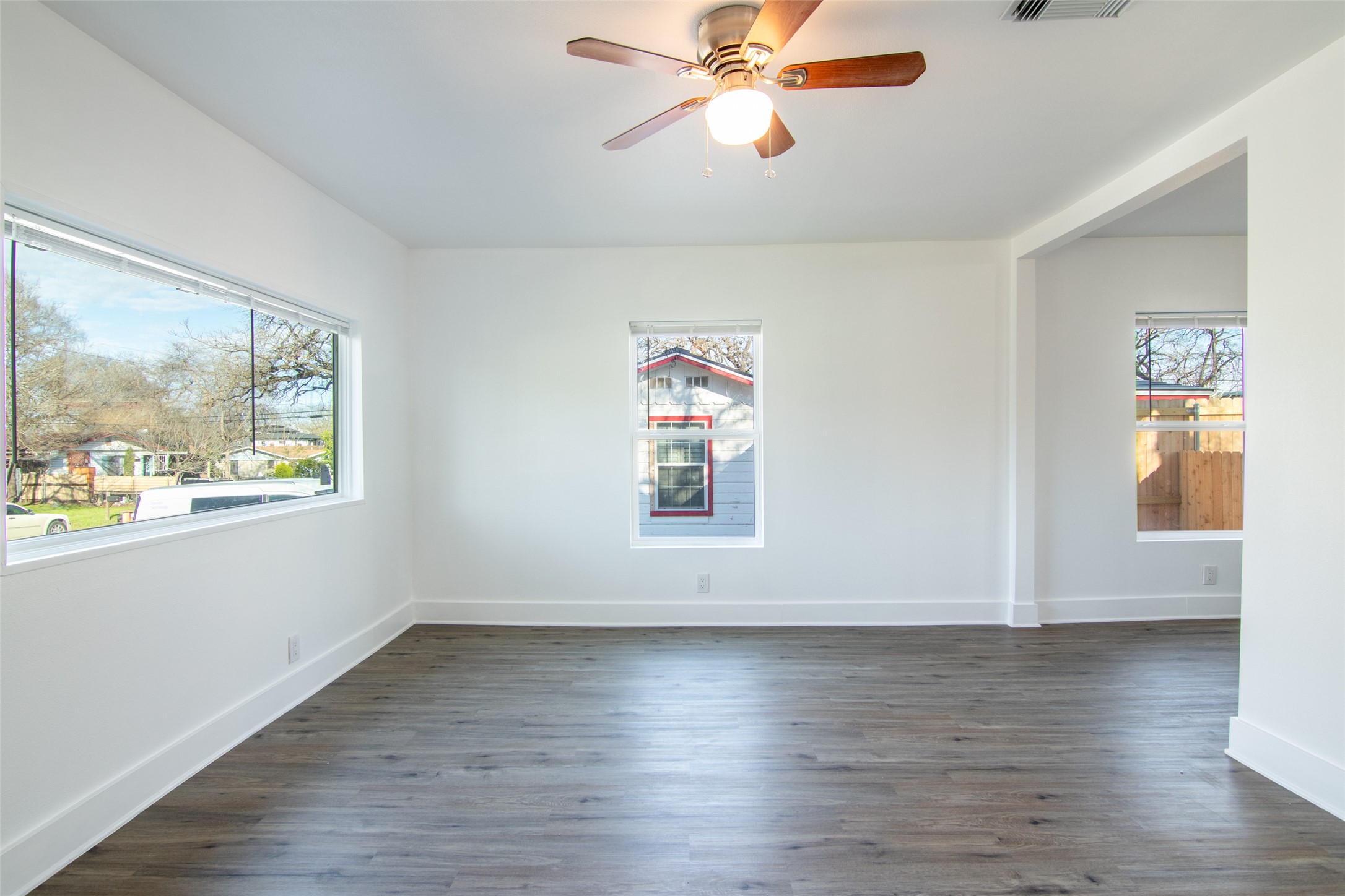3203 East 16th Street Austin, TX 78721 - Photo 4 of 21 Large picture window at the front of the home brings plenty of light into the main living space.
