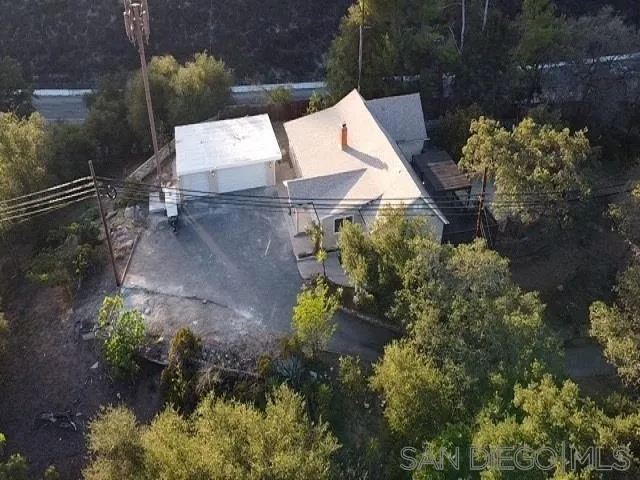 26945 Valley Center Road Valley Center, CA 92082 - Photo 11 of 17 an aerial view of a house with a yard and garden